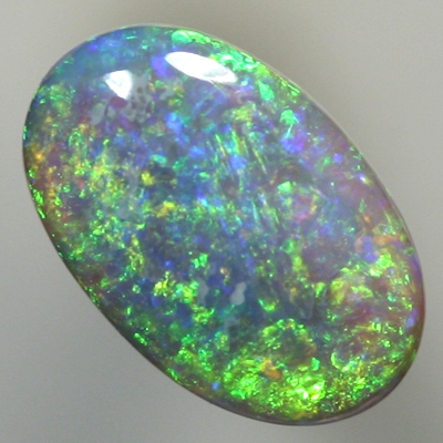 SOLID SEMI BLACK OPAL Sparkling green in a 3 dimensional pattern over blue